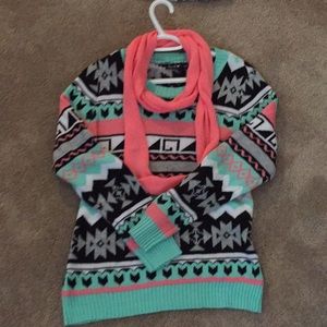 Pink, white, black, aqua sweater with pink scarf